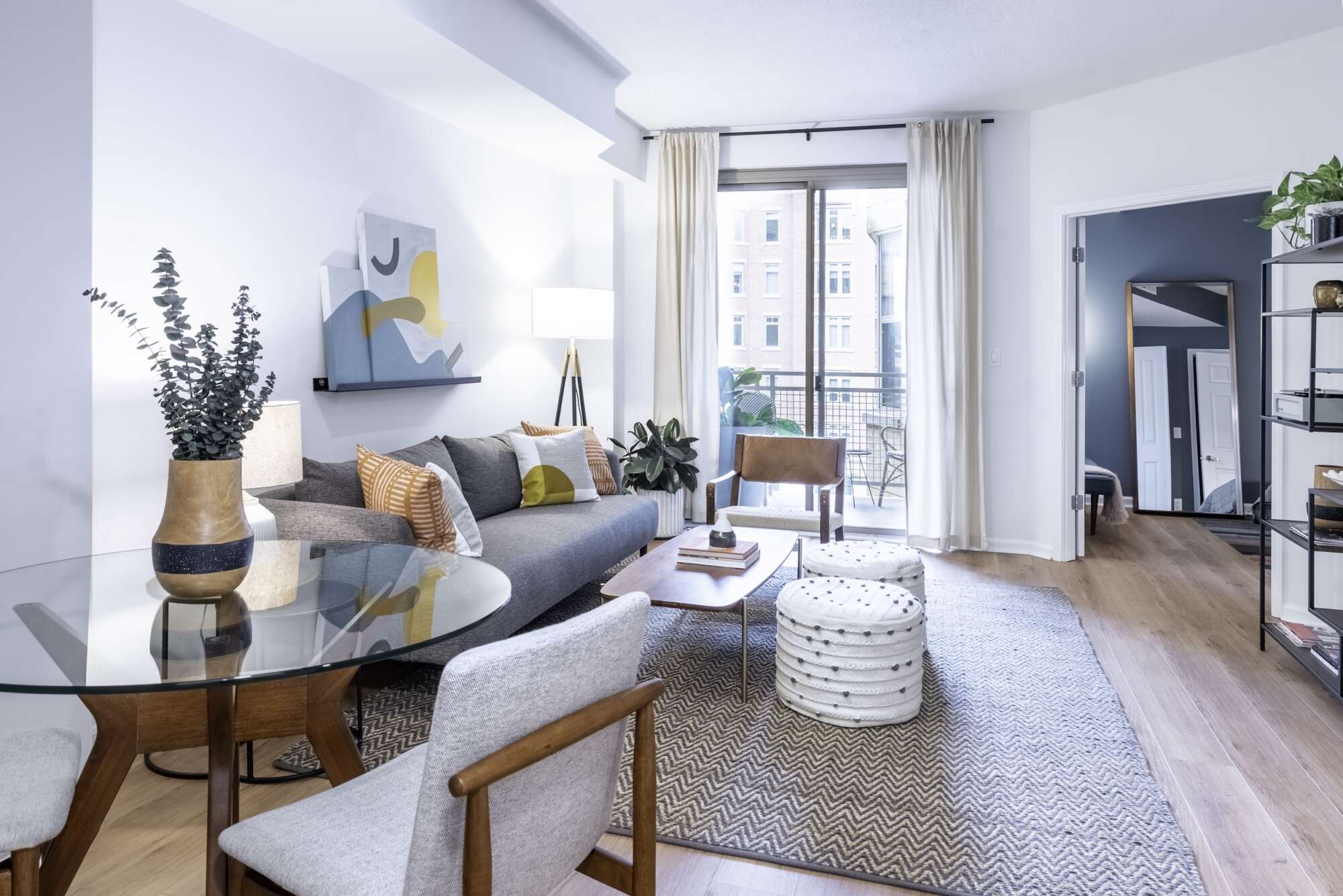 Living room of a model apartment at The Ellington with bright windows