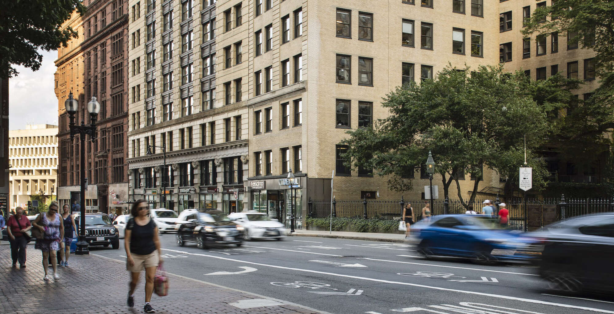 18 Tremont building facade with traffic and pedestrians in foreground