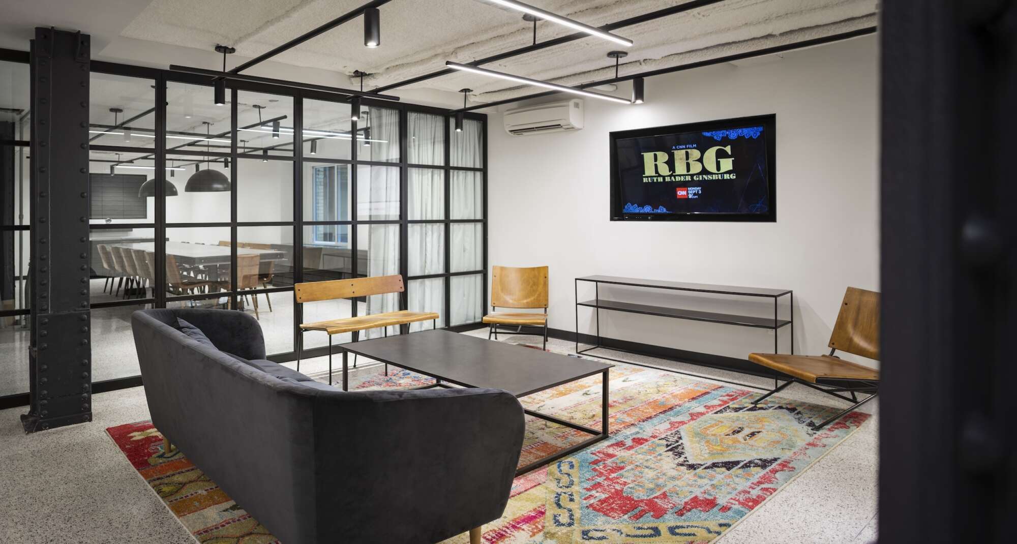 18 Tremont interior lounge common area with conference room in background