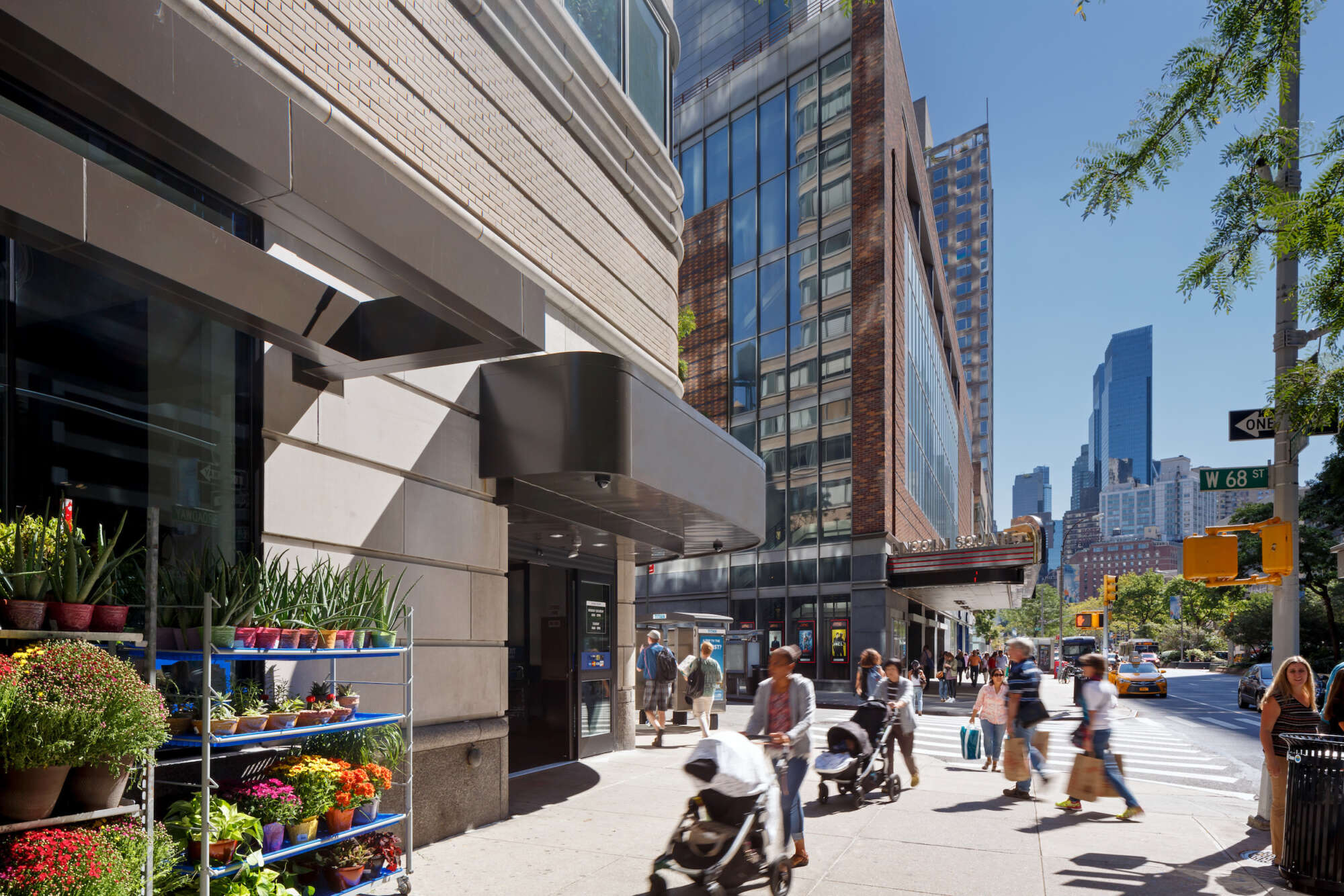 2000 Broadway retail store facade with pedestrians on sidewalk