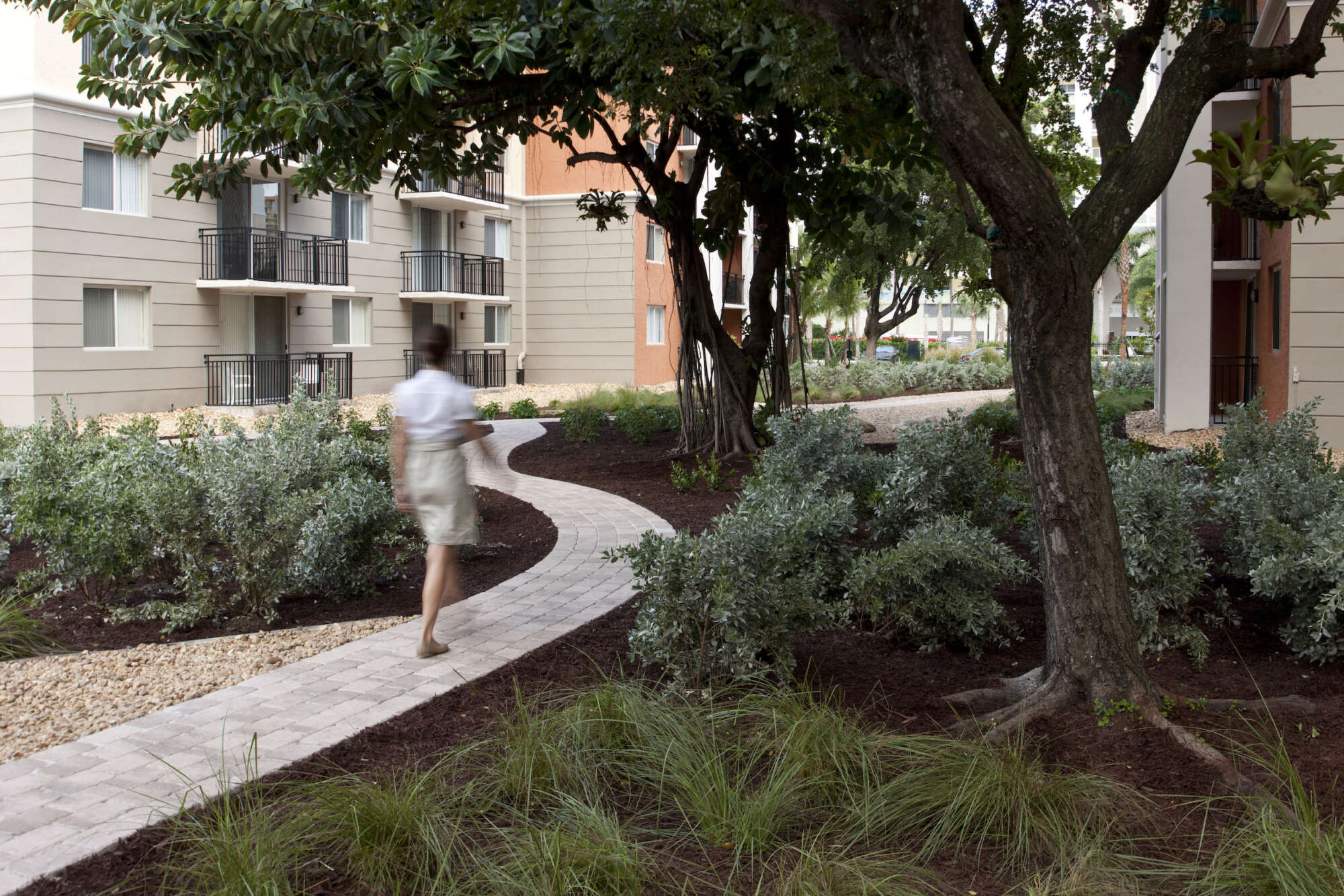 Beach Place exterior common area path with pedestrian