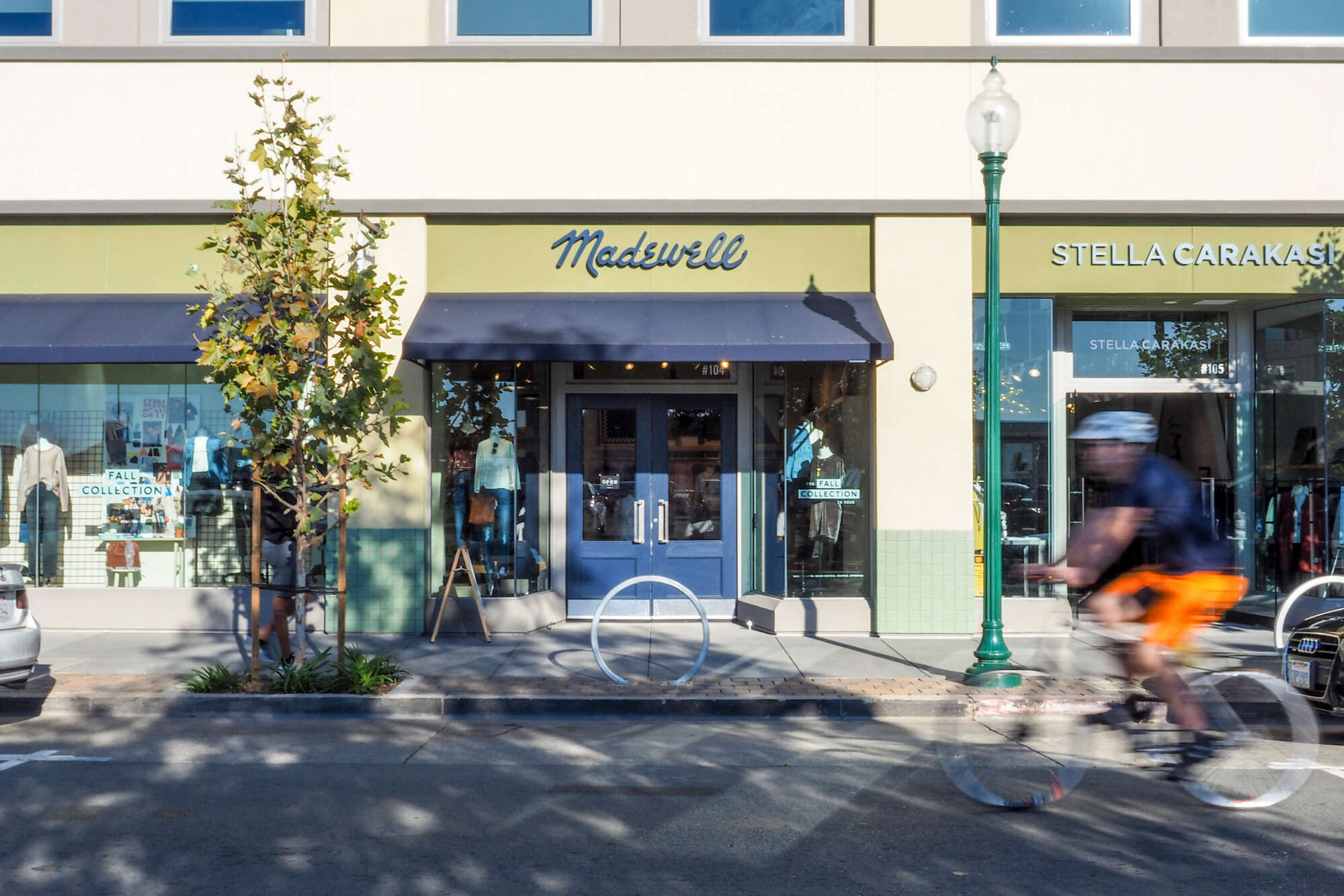 Fourth Street Berkeley retail store facades with bicyclist in street