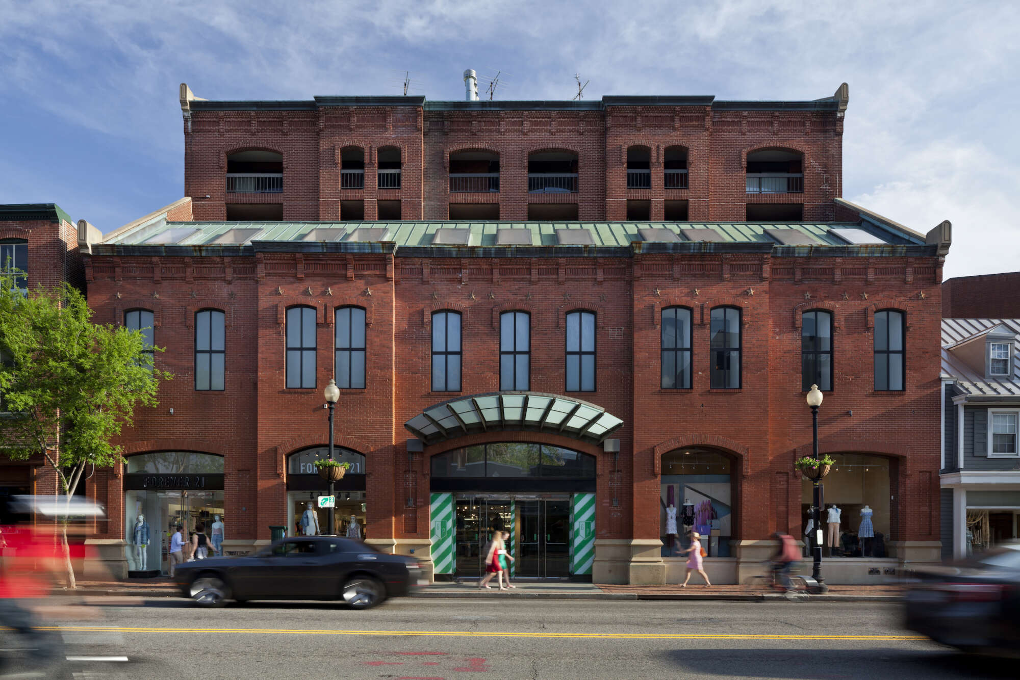 Georgetown Park retail shops exterior with cars and pedestrians in foreground