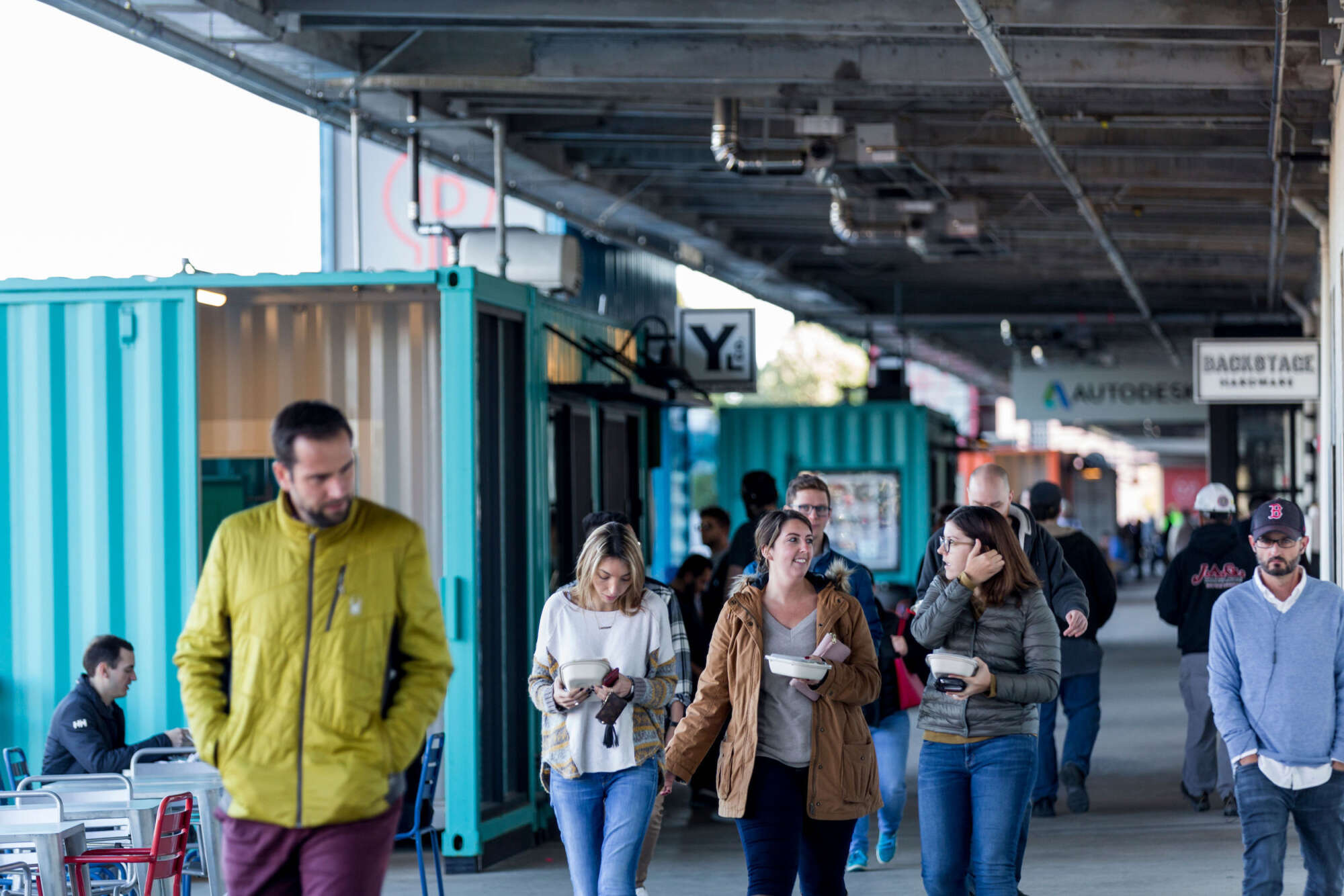 People walking the main promenade on the ground floor of The Innovation and Design Building