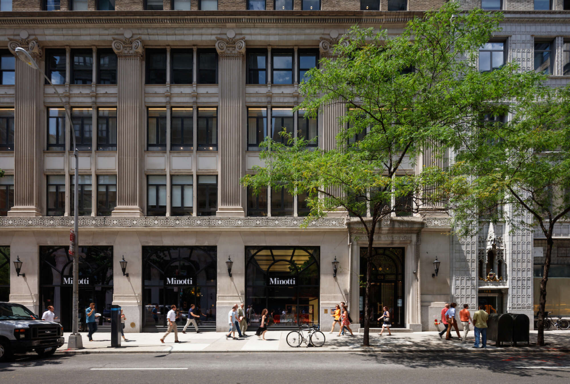 136 Madison exterior street level with people walking by