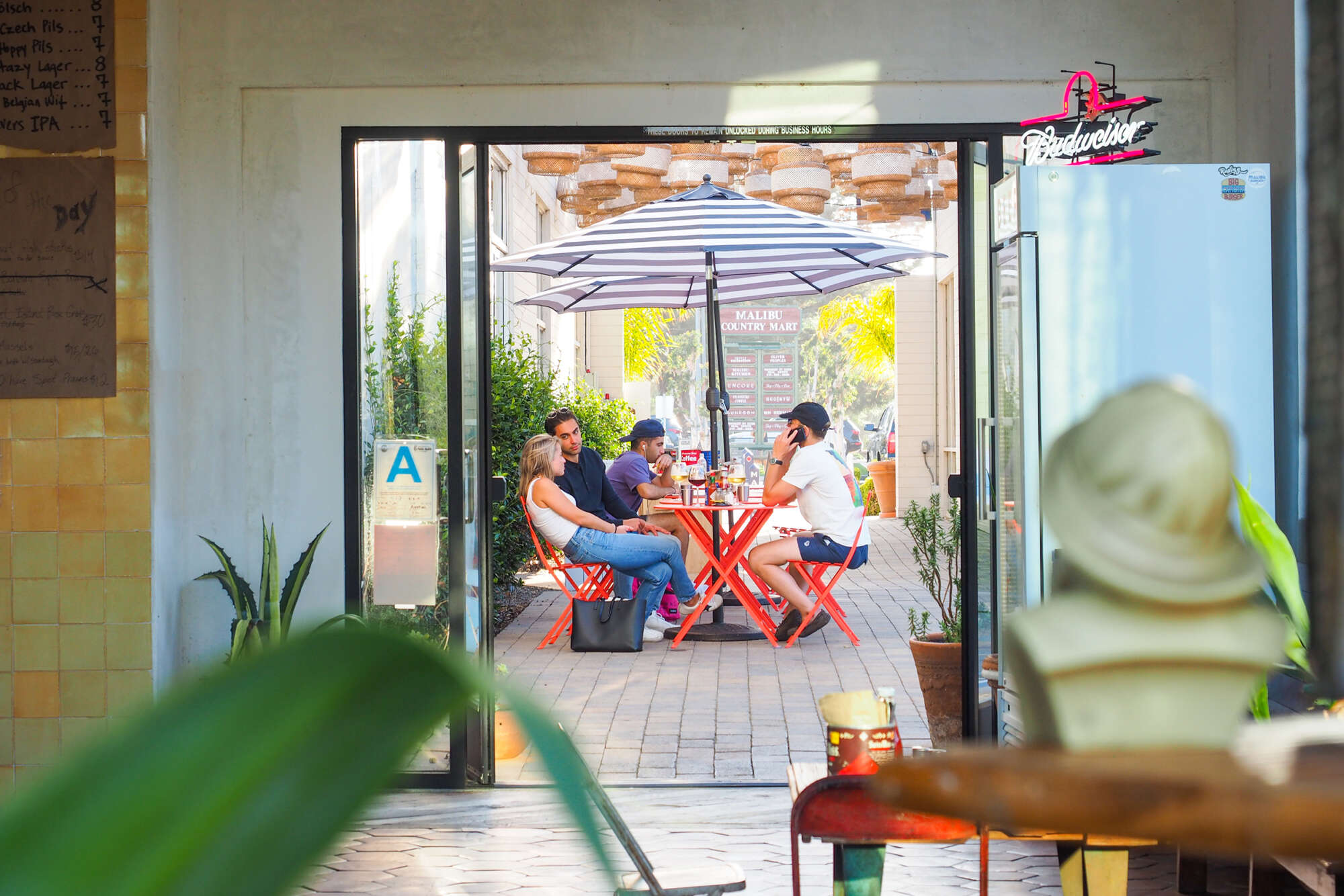 People dining at a patio cafe