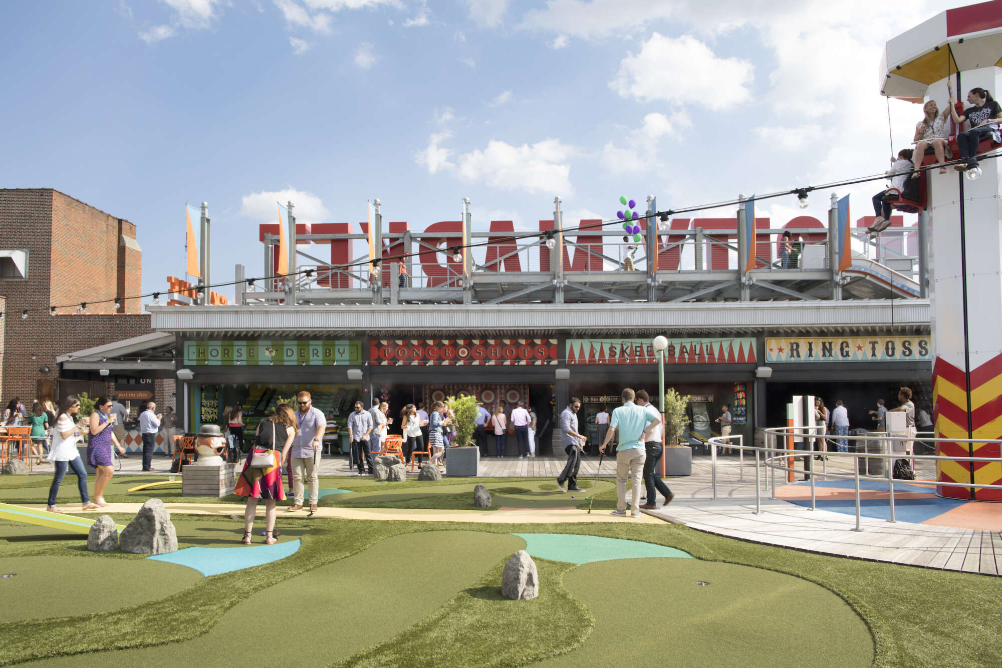 Rooftop of Ponce City Market with people enjoying the amusement park