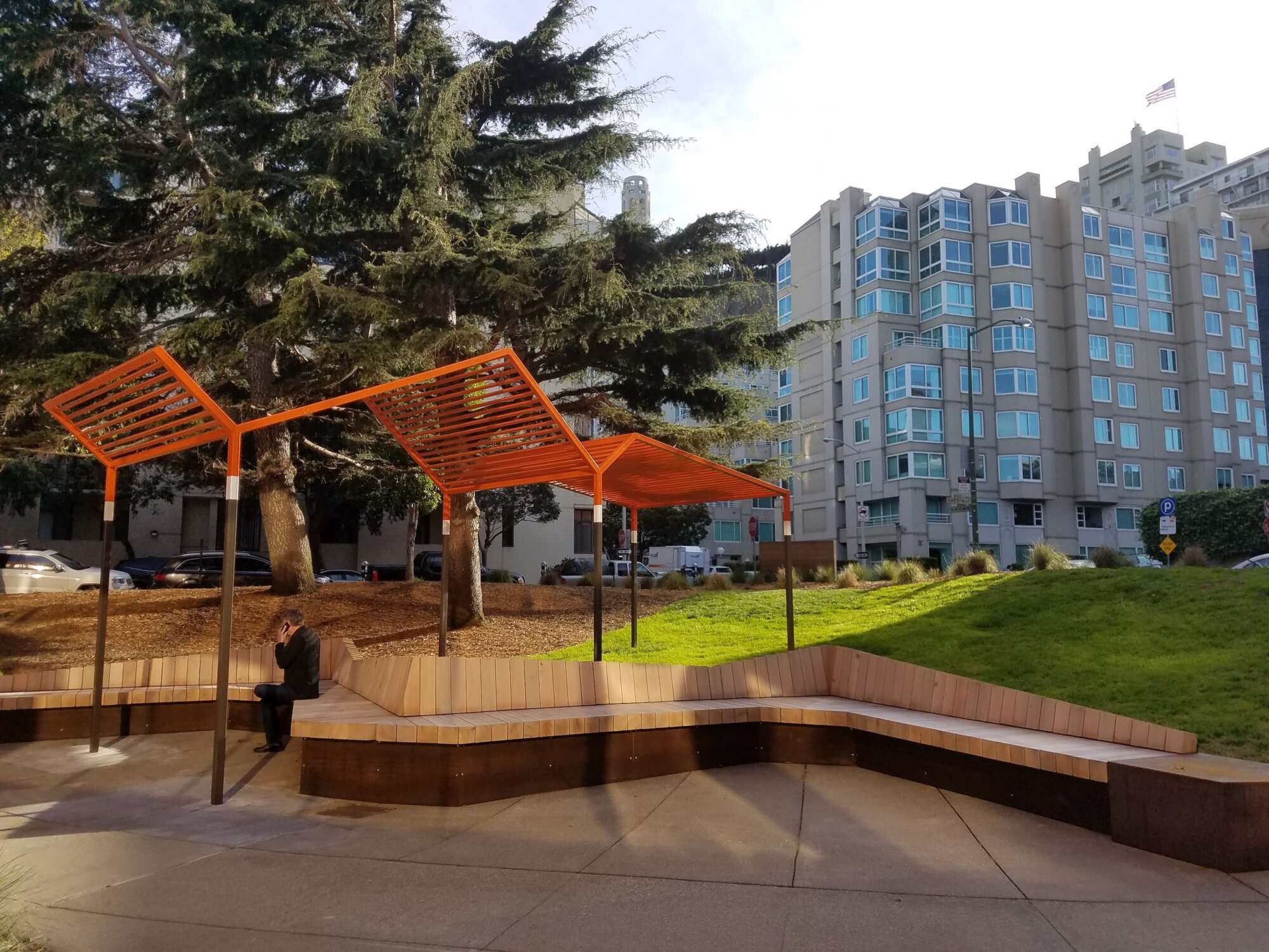 Backside of The Waterfront Collection with a man sitting on a bench