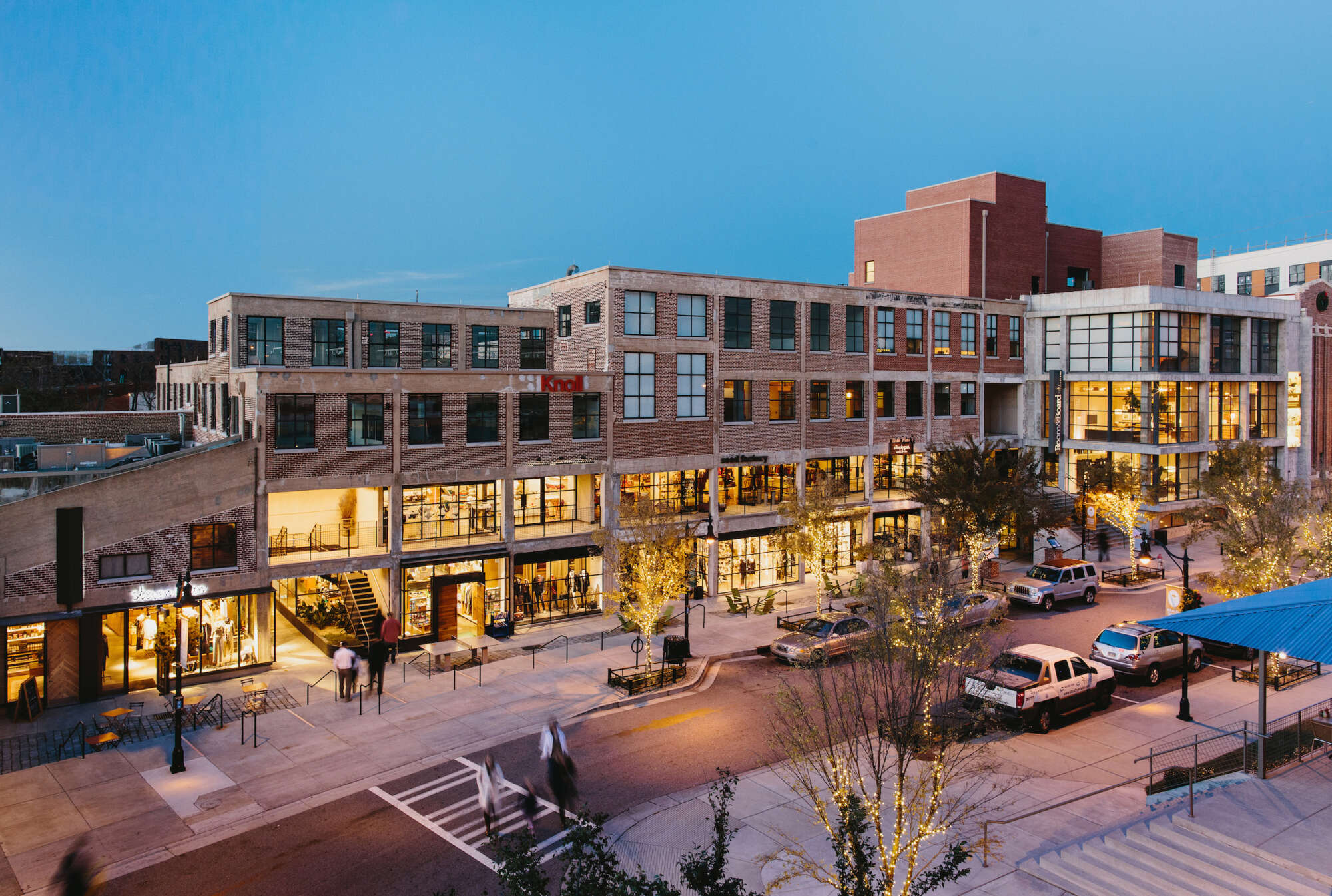 Elevated view of Westside Provisions District at evening with people crossing the street
