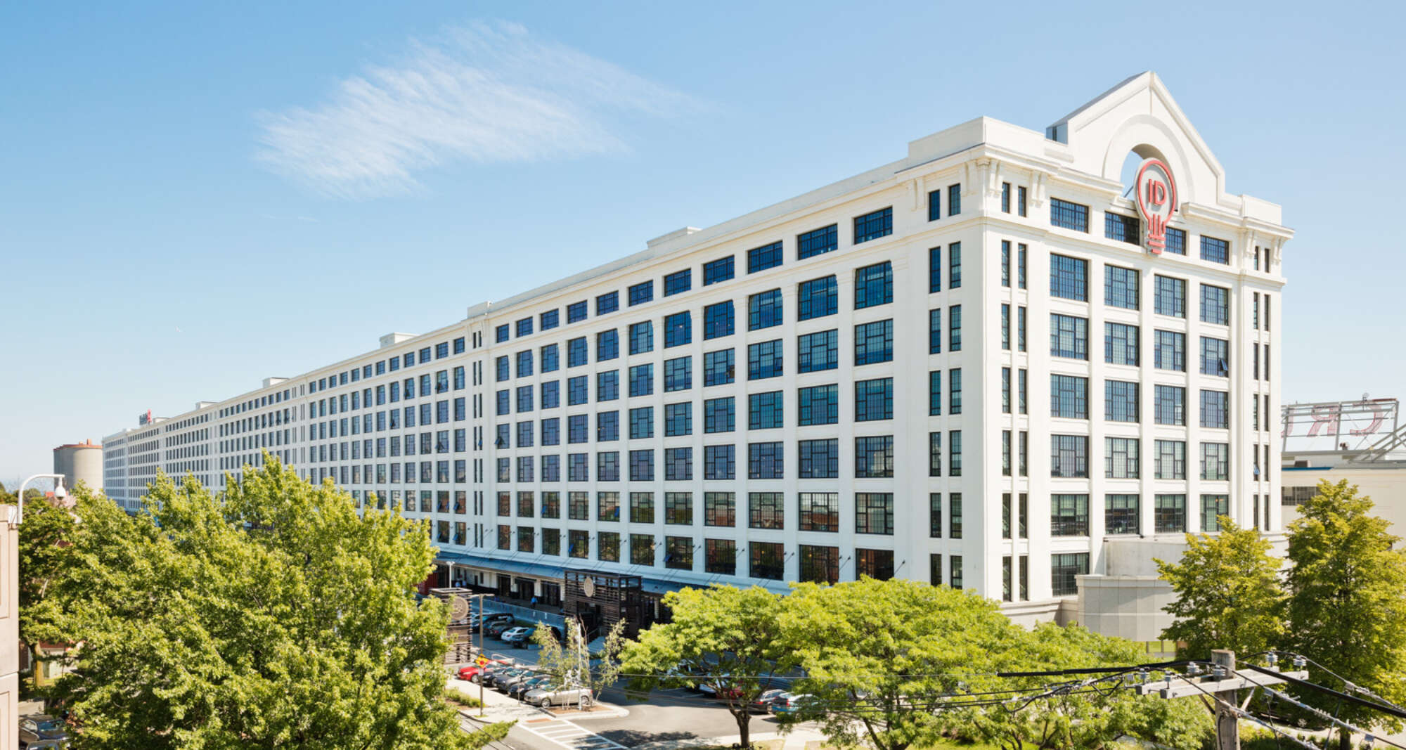 The Innovation and Design Building facade with trees in foreground